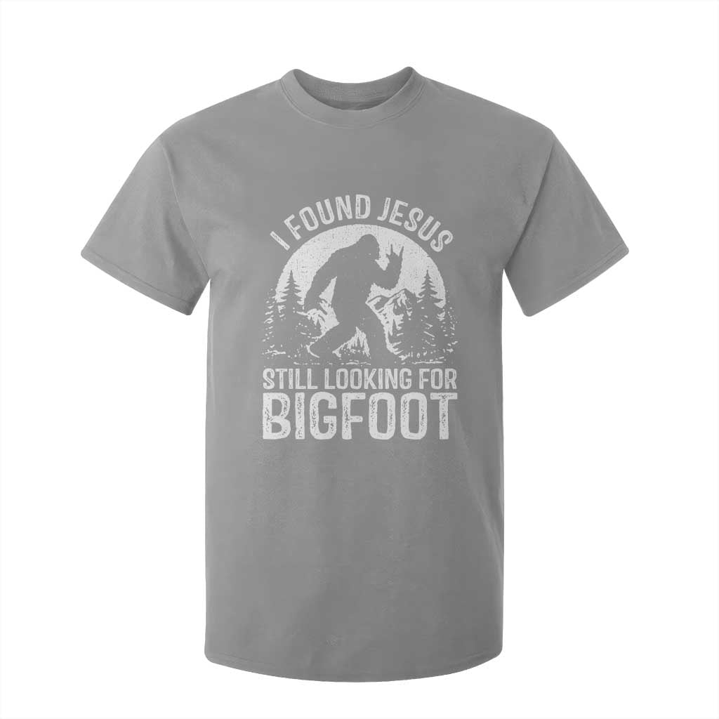 Funny Christian Sasquatch T Shirt For Kid I Found Jesus Still Looking for Bigfoot Vintage Distressed Graphic TS02 Sport Gray Print Your Wear