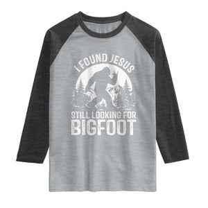 Funny Christian Sasquatch Raglan Shirt I Found Jesus Still Looking for Bigfoot Vintage Distressed Graphic TS02 Heather Gray Heather Charcoal Print Your Wear