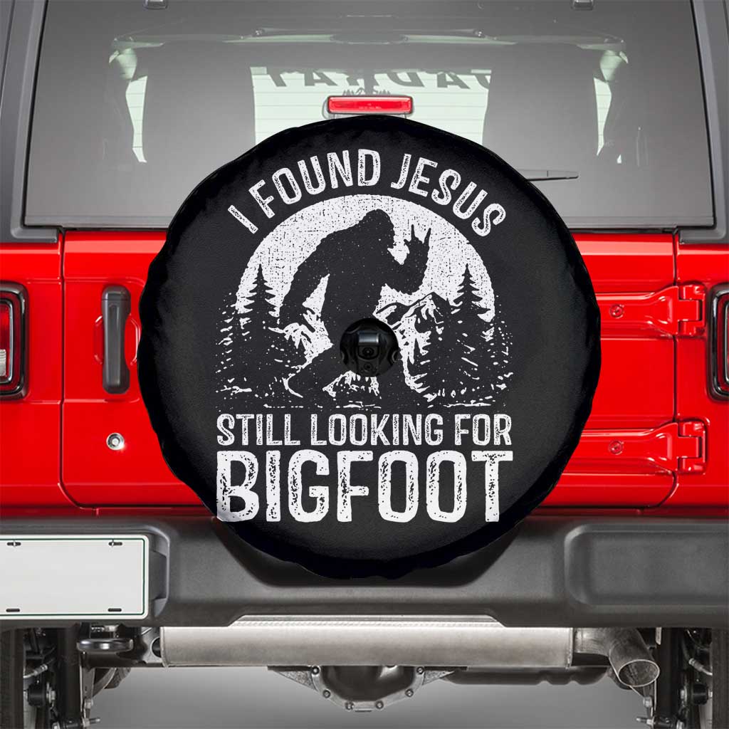 Funny Christian Sasquatch Spare Tire Cover I Found Jesus Still Looking for Bigfoot Vintage Distressed Graphic TS02 Black Print Your Wear