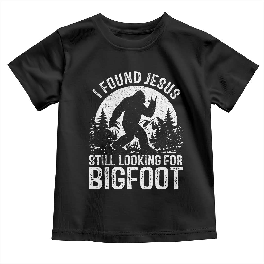 Funny Christian Sasquatch Toddler T Shirt I Found Jesus Still Looking for Bigfoot Vintage Distressed Graphic TS02 Black Print Your Wear
