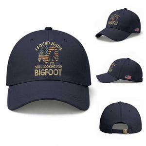 I Found Jesus Still Looking for Bigfoot Patriotic Baseball Cap American Flag Christian Religious Sasquatch Vintage TS02 Baseball Cap Universal Fit Navy Print Your Wear