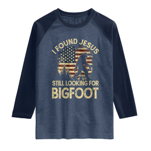 I Found Jesus Still Looking for Bigfoot Patriotic Raglan Shirt American Flag Christian Religious Sasquatch Vintage TS02 Heather Denim Navy Print Your Wear