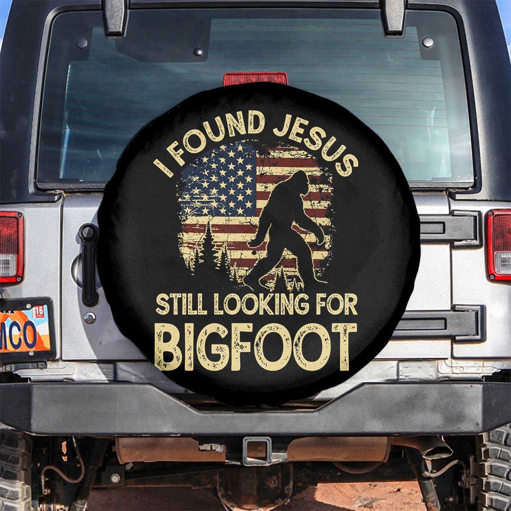 I Found Jesus Still Looking for Bigfoot Patriotic Spare Tire Cover American Flag Christian Religious Sasquatch Vintage TS02 No hole Black Print Your Wear
