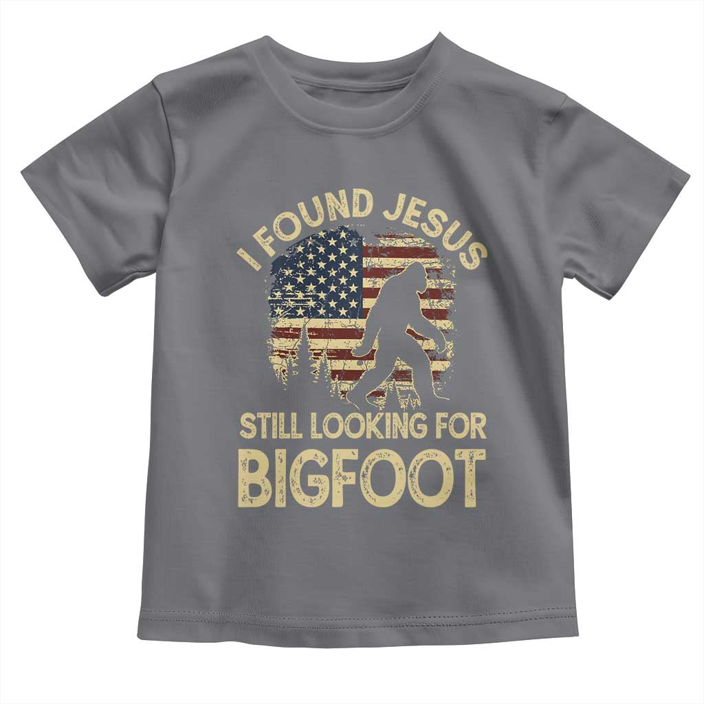 I Found Jesus Still Looking for Bigfoot Patriotic Toddler T Shirt American Flag Christian Religious Sasquatch Vintage TS02 Charcoal Print Your Wear