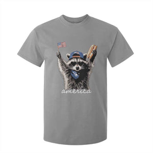 Funny America Raccoon Happy 4th of July T Shirt For Kid Holding Hotdog and US Flag Patriotic Graphic