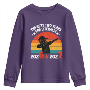 The Next Two Years Are Literally 6 7 Youth Sweatshirt Funny 2026 2027 Meme Dabbing Boy Retro TS02 Purple Print Your Wear