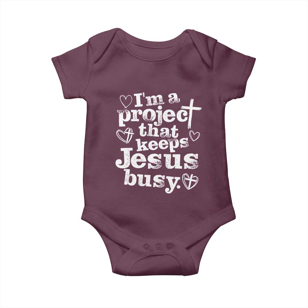 I am a Project That Keeps Jesus Busy Funny Christian Typography Baby Onesie Faith Humor Inspirational Gift TS02 Maroon Print Your Wear