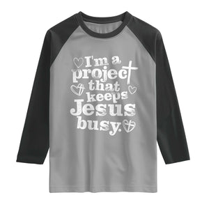 I am a Project That Keeps Jesus Busy Funny Christian Typography Raglan Shirt Faith Humor Inspirational Gift TS02 Sport Gray Black Print Your Wear