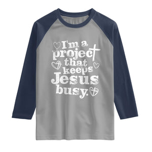 I am a Project That Keeps Jesus Busy Funny Christian Typography Raglan Shirt Faith Humor Inspirational Gift TS02 Sport Gray Navy Print Your Wear