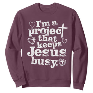 I am a Project That Keeps Jesus Busy Funny Christian Typography Sweatshirt Faith Humor Inspirational Gift TS02 Maroon Print Your Wear