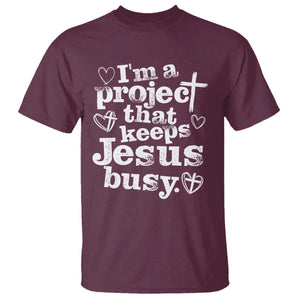 I am a Project That Keeps Jesus Busy Funny Christian Typography T Shirt - Faith Humor Inspirational Gift TS02 Maroon Print Your Wear