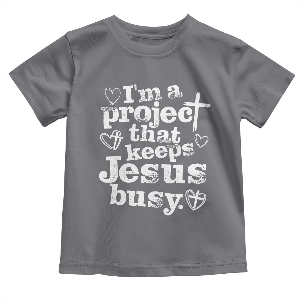 I am a Project That Keeps Jesus Busy Funny Christian Typography Toddler T Shirt Faith Humor Inspirational Gift TS02 Charcoal Print Your Wear