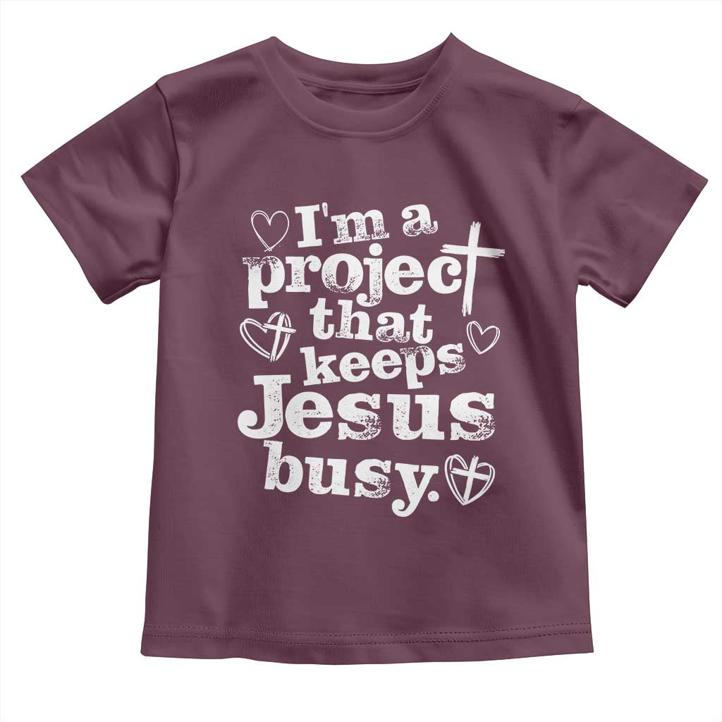 I am a Project That Keeps Jesus Busy Funny Christian Typography Toddler T Shirt Faith Humor Inspirational Gift TS02 Maroon Print Your Wear