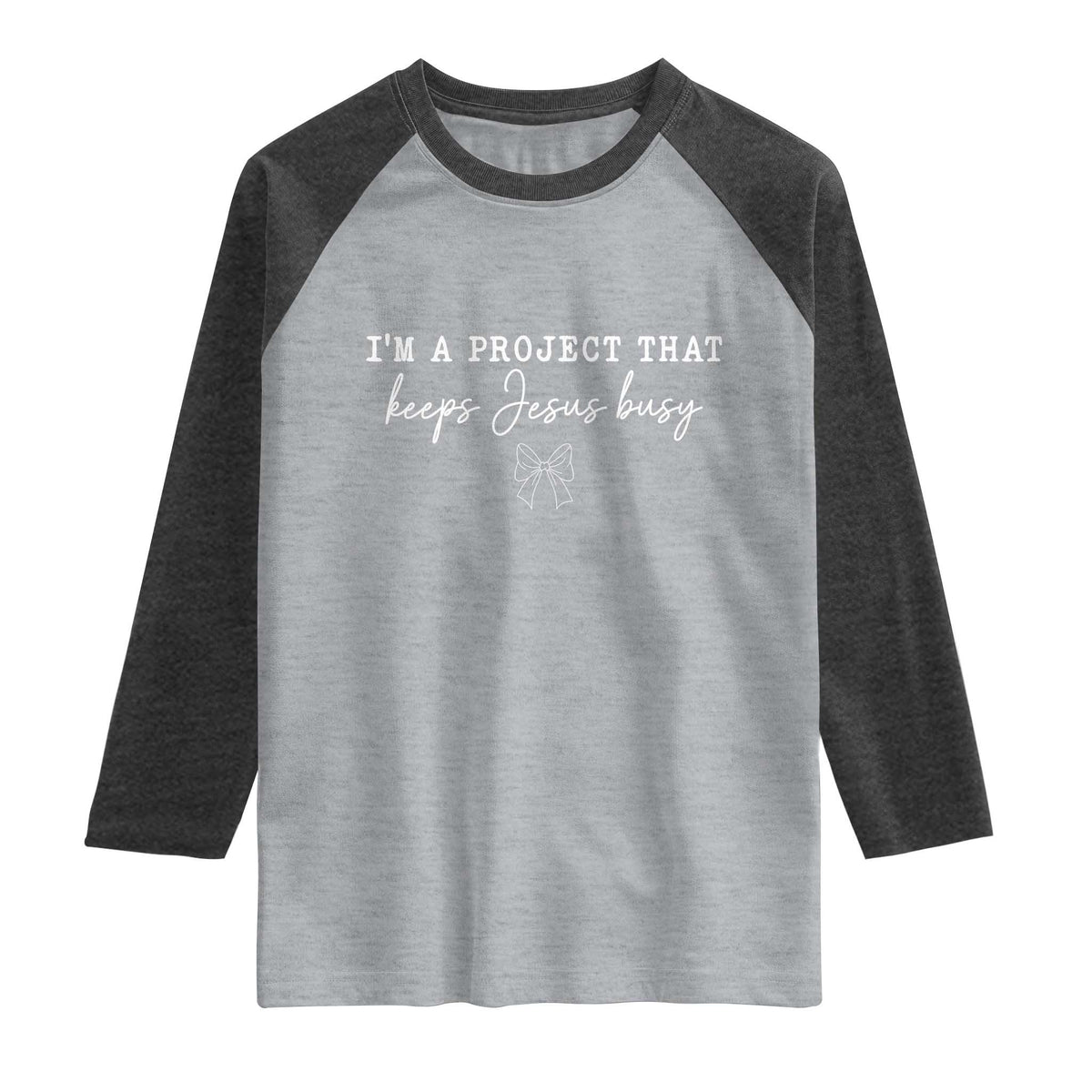 I am a Project That Keeps Jesus Busy Coquette Bow Raglan Shirt Christian Faith Humor TS02 Heather Gray Heather Charcoal Print Your Wear
