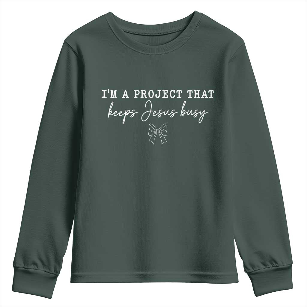 I am a Project That Keeps Jesus Busy Coquette Bow Youth Sweatshirt Christian Faith Humor TS02 Dark Forest Green Print Your Wear