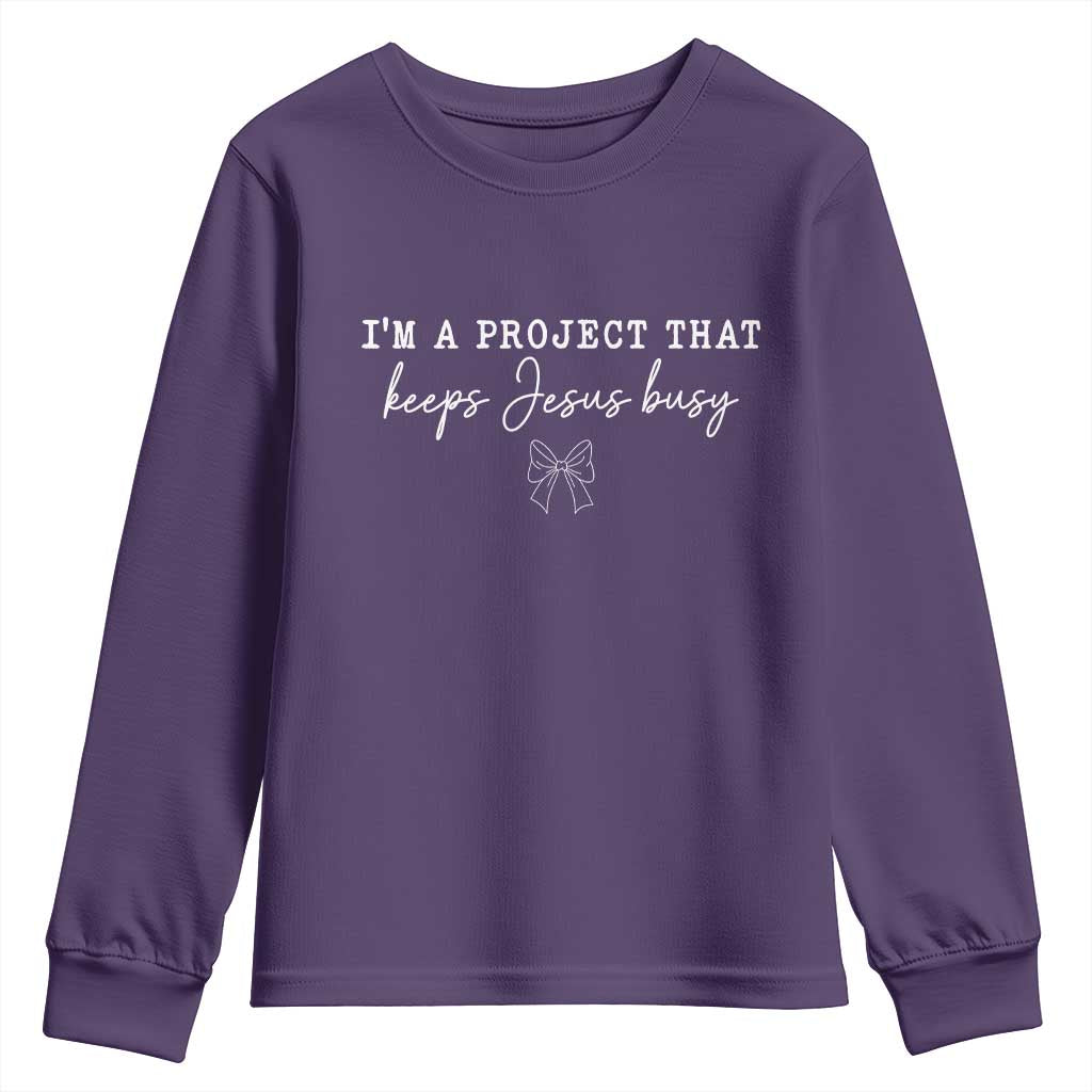 I am a Project That Keeps Jesus Busy Coquette Bow Youth Sweatshirt Christian Faith Humor TS02 Purple Print Your Wear