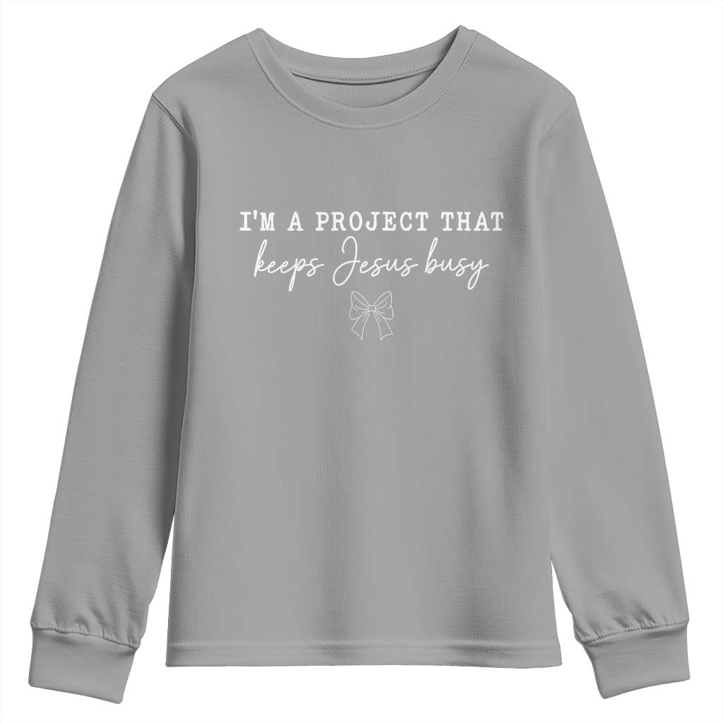 I am a Project That Keeps Jesus Busy Coquette Bow Youth Sweatshirt Christian Faith Humor TS02 Sport Gray Print Your Wear