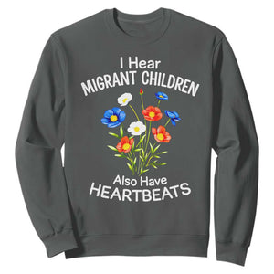 I Hear Migrant Children Also Have Heartbeats Sweatshirt Wildflower Floral Social Justice Human Rights TS02 Dark Heather Print Your Wear