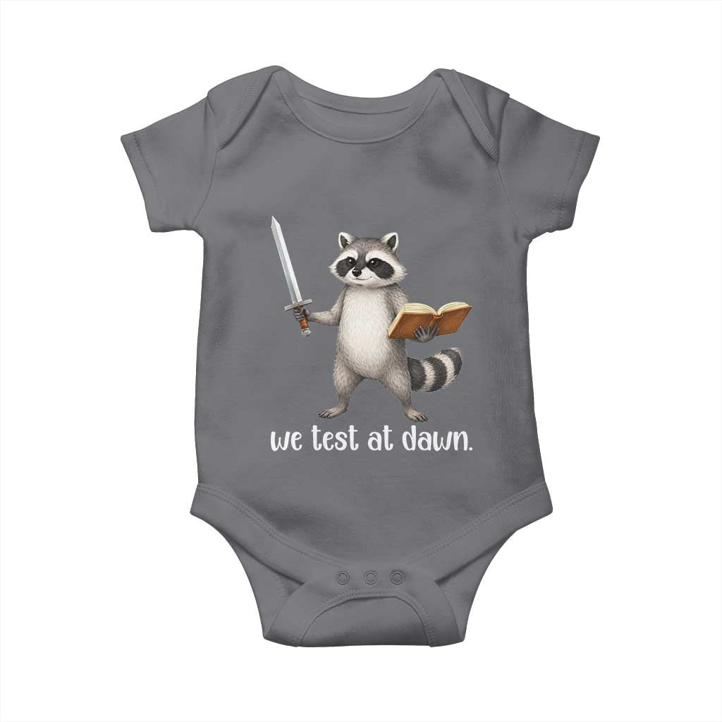 We Test At Dawn Raccoon Warrior Baby Onesie Funny Student Teacher Exam Motivation TS02 Charcoal Print Your Wear