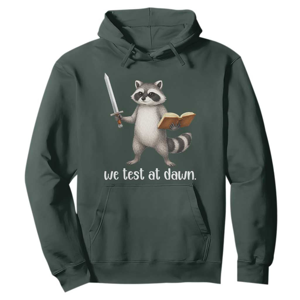 We Test At Dawn Raccoon Warrior Hoodie Funny Student Teacher Exam Motivation TS02 Dark Forest Green Print Your Wear