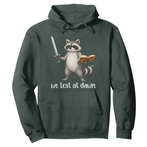 We Test At Dawn Raccoon Warrior Hoodie Funny Student Teacher Exam Motivation TS02 Dark Forest Green Print Your Wear
