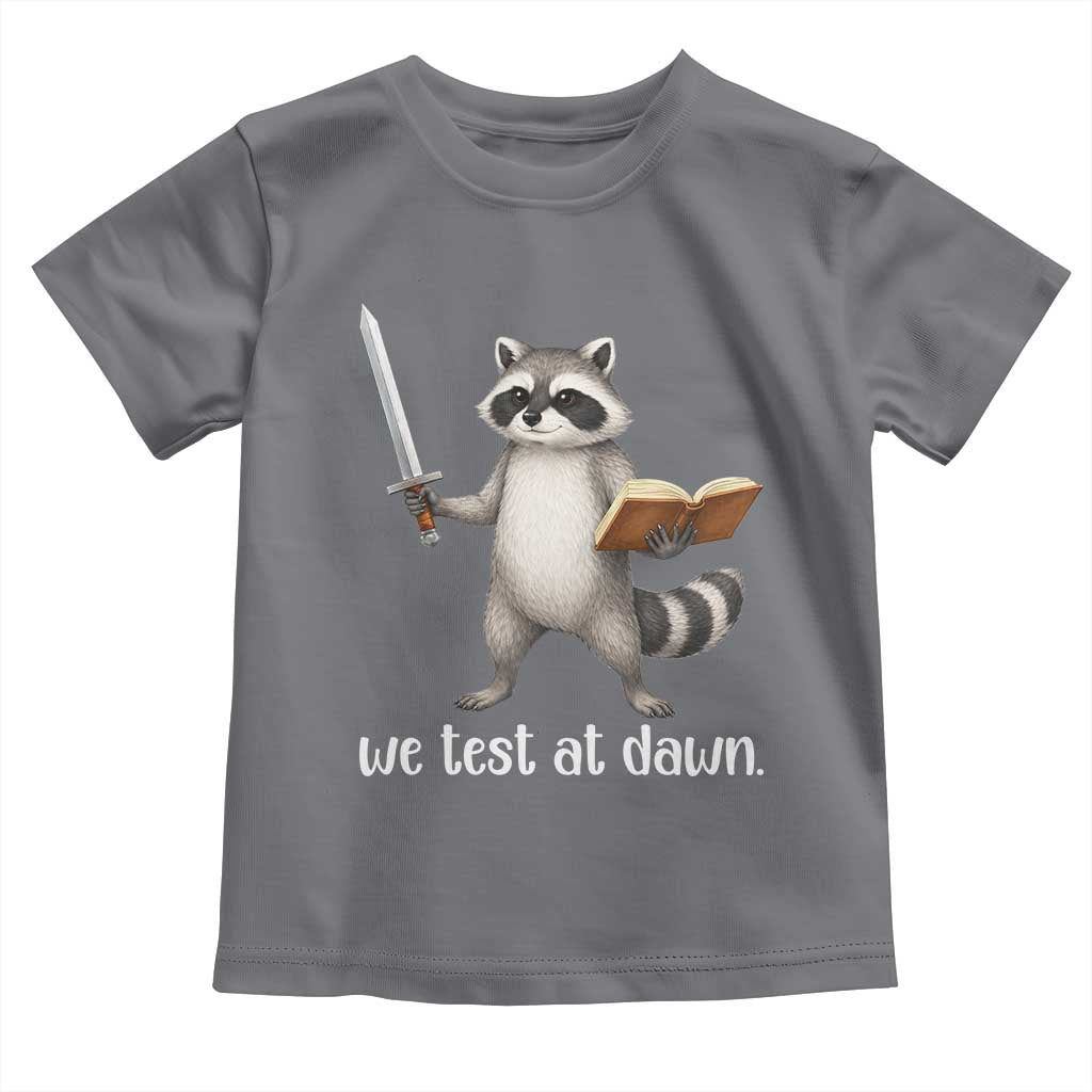 We Test At Dawn Raccoon Warrior Toddler T Shirt Funny Student Teacher Exam Motivation TS02 Charcoal Print Your Wear