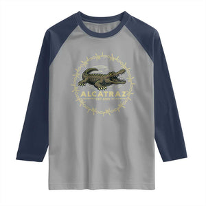 Alligator Alcatraz 2025 Raglan Shirt Gator Lockdown Political Satire Barbed Wire Swamp Humor TS02 Sport Gray Navy Print Your Wear