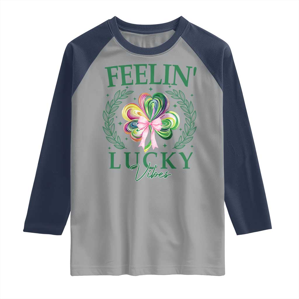 St. Patrick's Day Raglan Shirt Feelin' Lucky Vibes Shamrock Coquette Bow TS09 Sport Gray Navy Print Your Wear