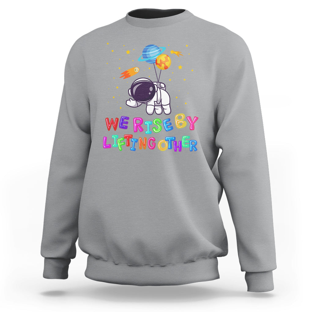 We Rise By Lifting Other Outer Space Astronaut Planet Balloon Motivational Quote Sweatshirt TS09 Sport Gray Printyourwear