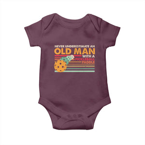 Funny Pickleball Baby Onesie Never Underestimate An Old Man With A Pickleball Paddle TS09 Maroon Print Your Wear