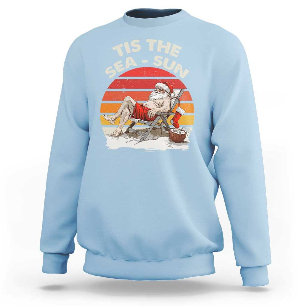 Funny Christmas In July Sweatshirt Tis The Sea Sun Santa At The Beach TS09 Light Blue Print Your Wear