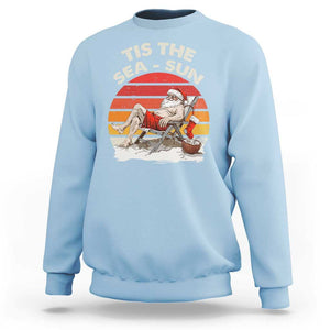 Funny Christmas In July Sweatshirt Tis The Sea Sun Santa At The Beach TS09 Light Blue Print Your Wear