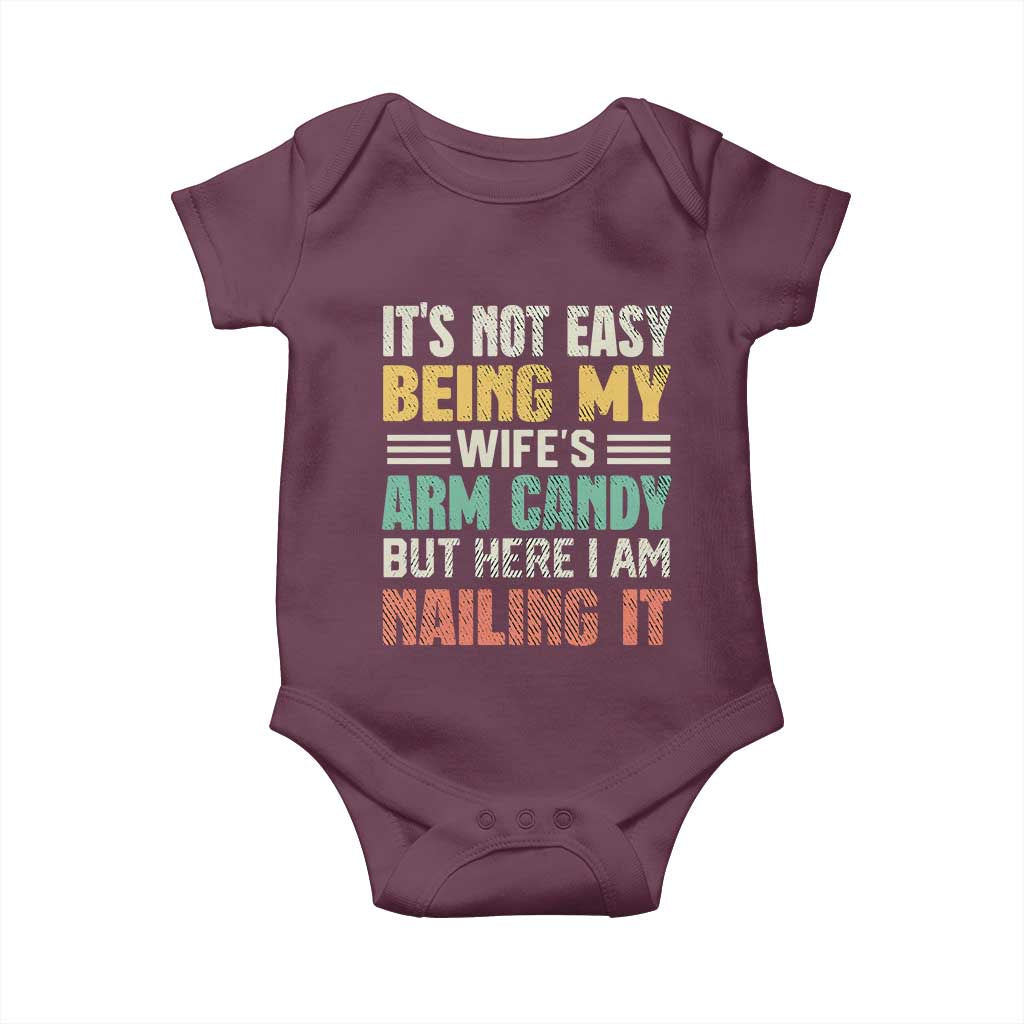 Funny Husband Baby Onesie It's Not Easy Being My Wife's Arm Candy TS09 Maroon Print Your Wear