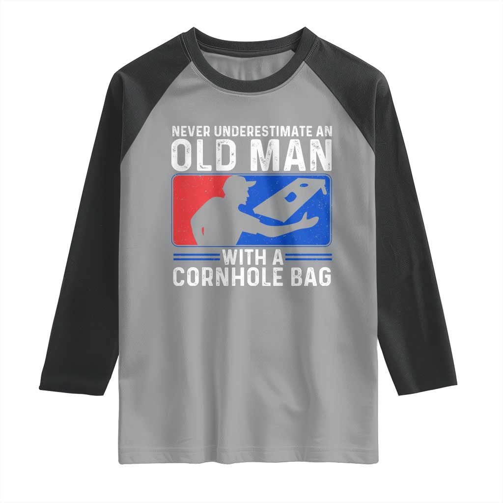 Funny Cornhole Player Raglan Shirt Never Underestimate An Old Man With A Cornhole Bag TS10 Sport Gray Black Print Your Wear