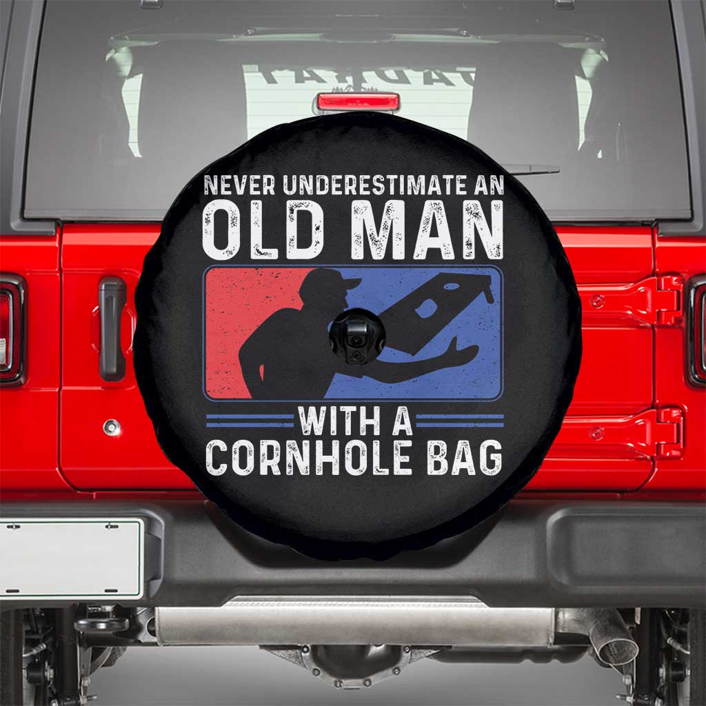 Funny Cornhole Player Spare Tire Cover Never Underestimate An Old Man With A Cornhole Bag TS10 Black Print Your Wear