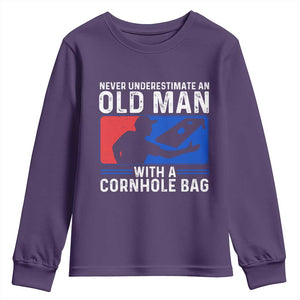 Funny Cornhole Player Youth Sweatshirt Never Underestimate An Old Man With A Cornhole Bag TS10 Purple Print Your Wear