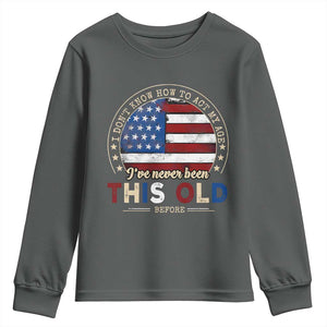 Dont Know How To Act My Age Youth Sweatshirt Vintage Funny Old Man Saying American Flag TS10 Dark Heather Print Your Wear