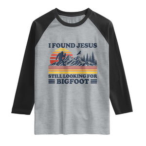 Retro I Found Jesus Still Looking For Bigfoot Raglan Shirt Funny Sasquatch Bigfoot Believer Christian Humor TS10 Heather Gray Black Print Your Wear