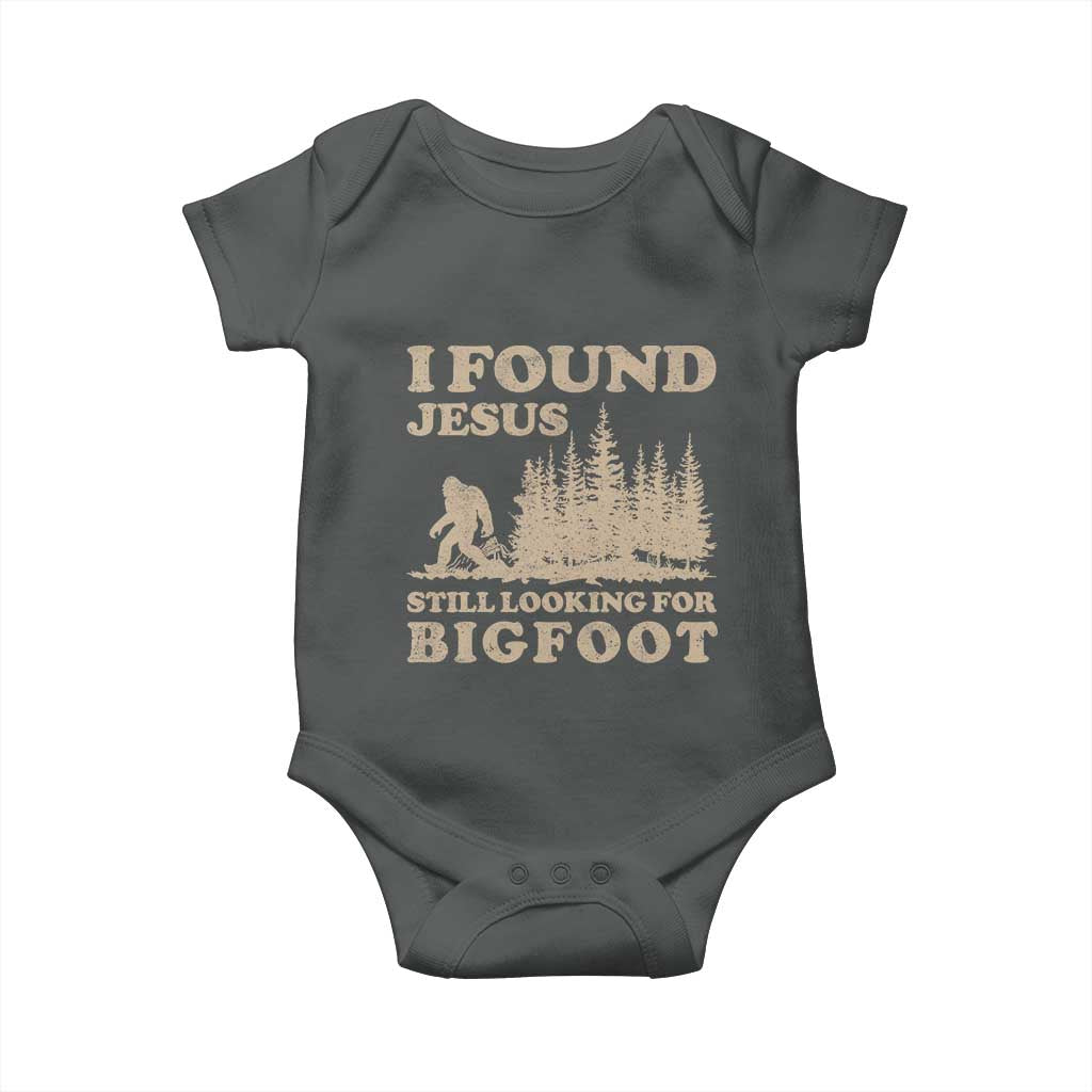 Retro I Found Jesus Still Looking For Bigfoot Baby Onesie Vintage Sasquatch Believer Funny Christian Humor TS10 Dark Heather Print Your Wear
