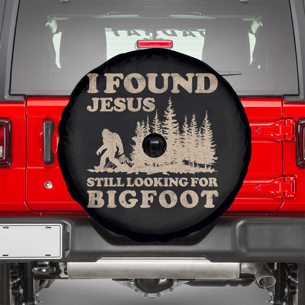 Retro I Found Jesus Still Looking For Bigfoot Spare Tire Cover Vintage Sasquatch Believer Funny Christian Humor TS10 Black Print Your Wear
