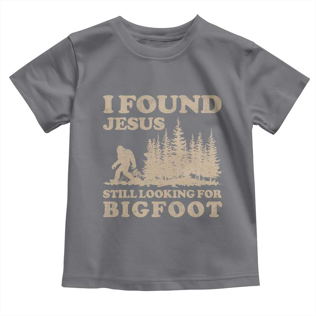 Retro I Found Jesus Still Looking For Bigfoot Toddler T Shirt Vintage Sasquatch Believer Funny Christian Humor TS10 Charcoal Print Your Wear