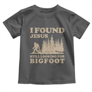 Retro I Found Jesus Still Looking For Bigfoot Toddler T Shirt Vintage Sasquatch Believer Funny Christian Humor TS10 Dark Heather Print Your Wear