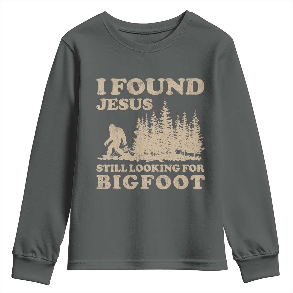 Retro I Found Jesus Still Looking For Bigfoot Youth Sweatshirt Vintage Sasquatch Believer Funny Christian Humor TS10 Dark Heather Print Your Wear