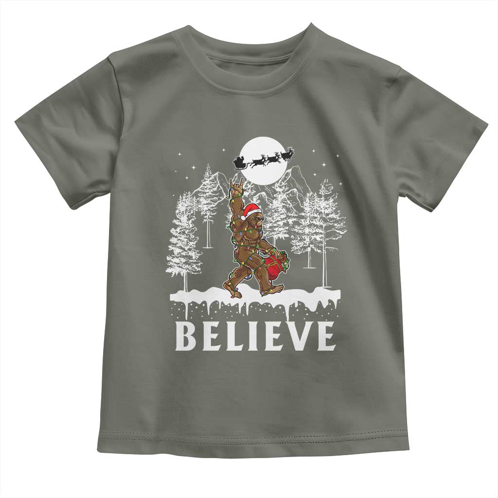 Bigfoot Christmas Tree Lights Baby Shirt Believe Rock On Sasquatch Santa Hat TS10 Military Green Print Your Wear