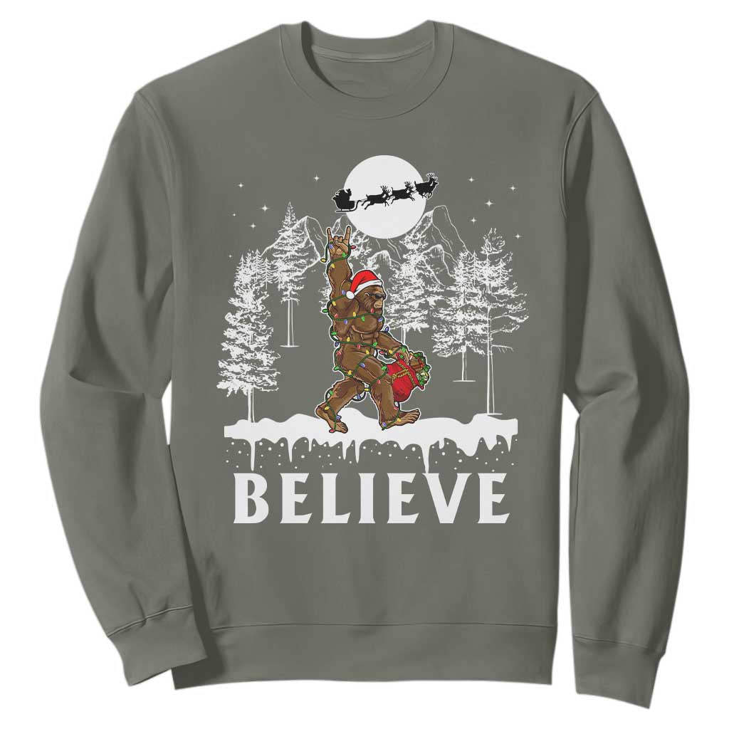 Bigfoot Christmas Tree Lights Sweatshirt Believe Rock On Sasquatch Santa Hat TS10 Military Green Print Your Wear