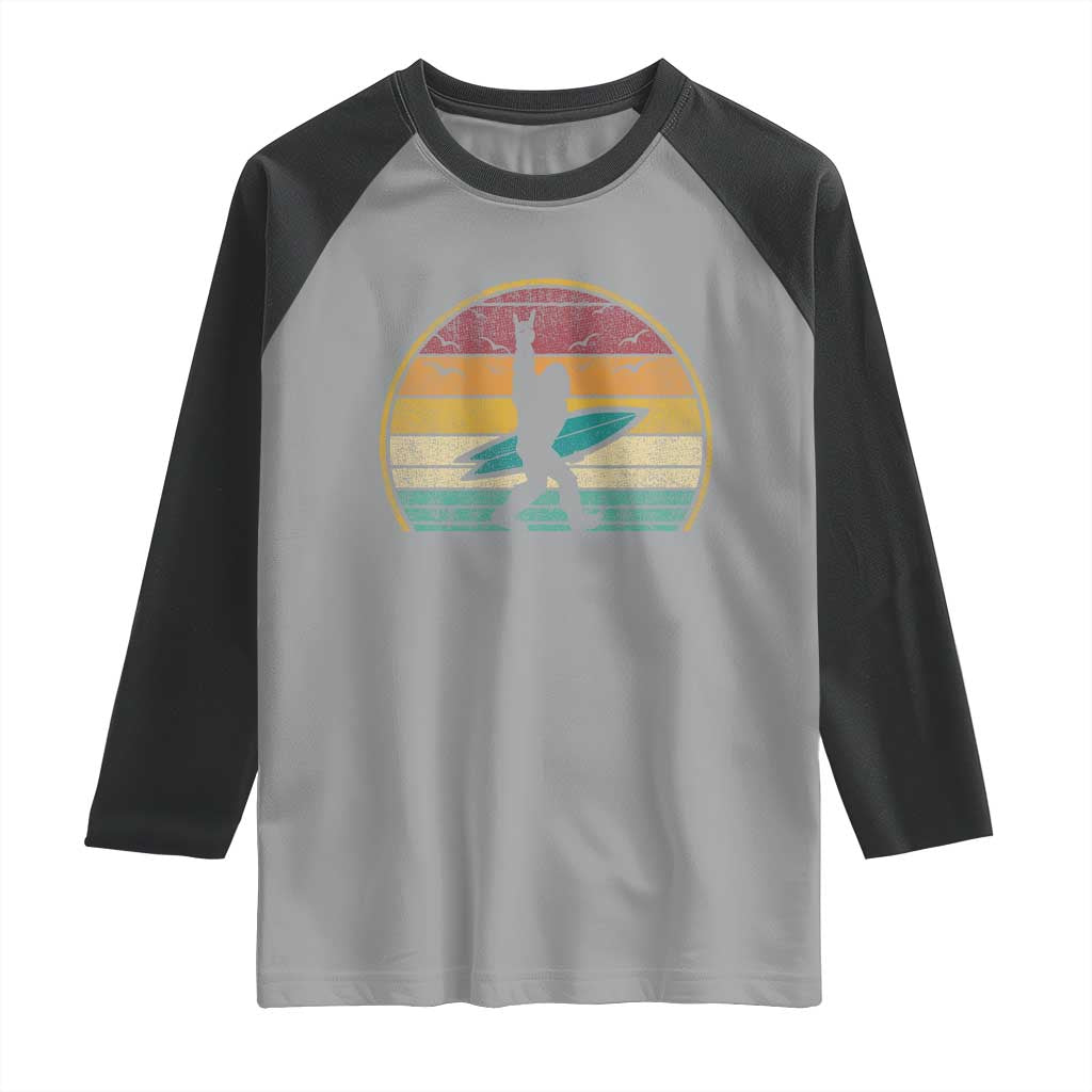 Vintage Bigfoot Surfing Raglan Shirt Sasquatch Beach Vacation Retro Surf Sun Shaka TS10 Sport Gray Black Print Your Wear