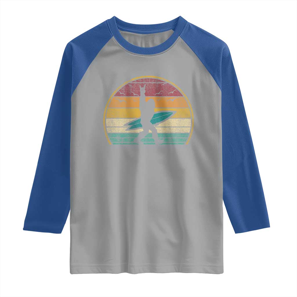 Vintage Bigfoot Surfing Raglan Shirt Sasquatch Beach Vacation Retro Surf Sun Shaka TS10 Sport Gray Royal Print Your Wear