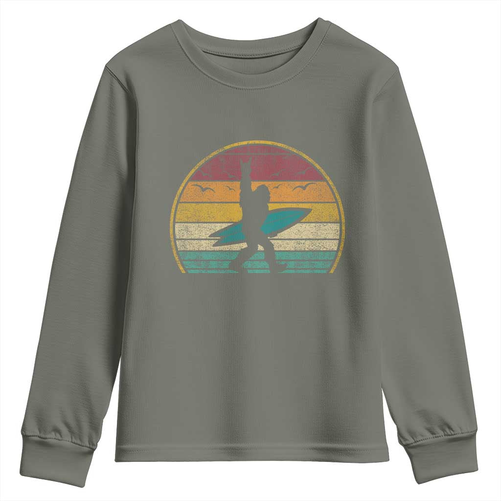 Vintage Bigfoot Surfing Youth Sweatshirt Sasquatch Beach Vacation Retro Surf Sun Shaka TS10 Military Green Print Your Wear