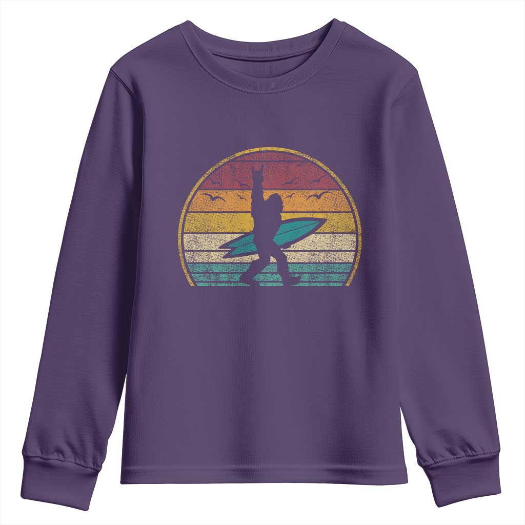 Vintage Bigfoot Surfing Youth Sweatshirt Sasquatch Beach Vacation Retro Surf Sun Shaka TS10 Purple Print Your Wear
