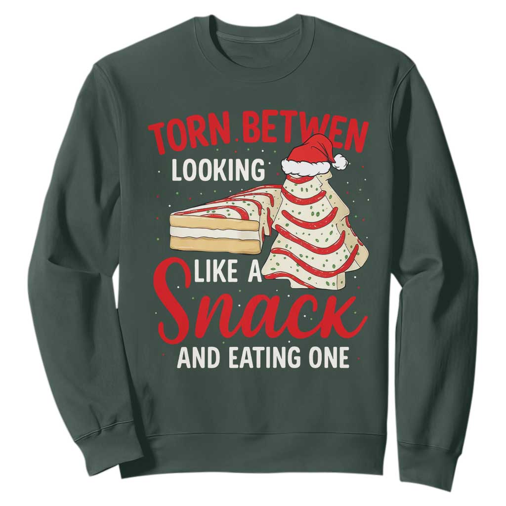 Torn Between Looking Like A Snack Or Eating One Christmas Sweatshirt Debbies Tree Cake TS10 Dark Forest Green Print Your Wear